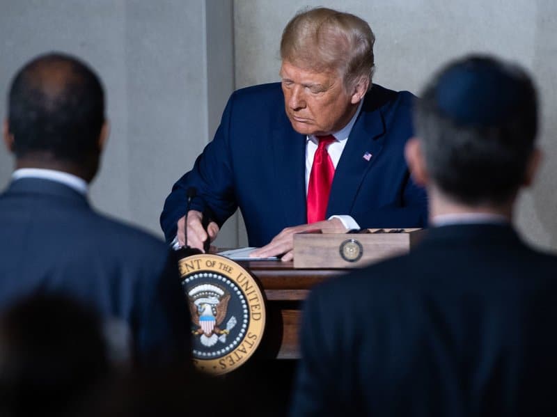 President Trump holds a Constitution Day proclamation after speaking Thursday during the White House Conference on American History at the National Archives in Washington, D.C.
