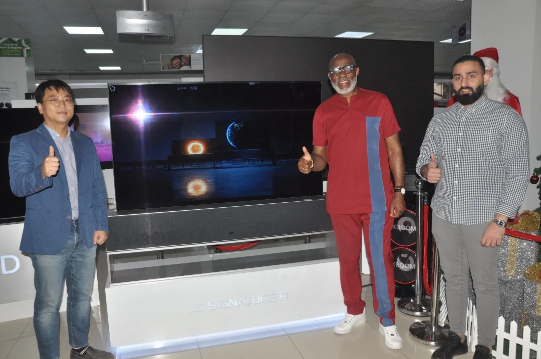 Pix 1----Colors Showroom Manager, Fouani Nigeria Limited, Mr. Mohammed Hoballah, LG OLED TV Brand Ambassador and Award-winning Nollywood Actor, Mr. Richard Mofe-Damijo and General Manager, Home Entertainment, TV Division, LG Electronics West Africa, Mr. Choong Bae Seok at the official launch of the world's first LG SIGNATURE OLED ROLLABLE