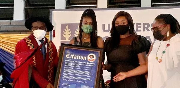 Awo Tsumasi and other members of GAG presenting a citation to Professor Eric Sampane-Donkor