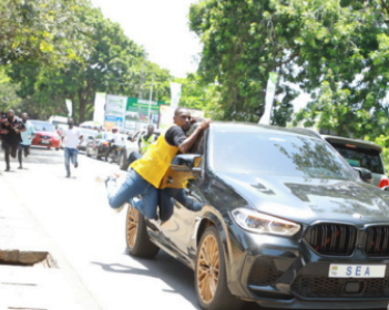 Die-hard Adebayor fan dangerously hands-on moving car to meet his idol. This is how crazy fans of football fans can be